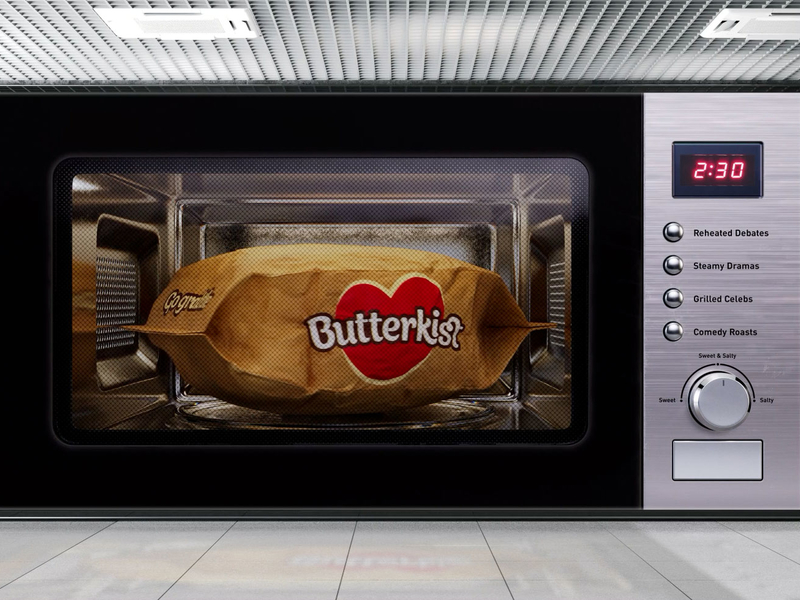 These supersized outdoor ads totally get the weird appeal of watching microwave popcorn cook