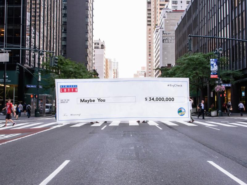 NY Lotto Throws a Giant Check in New Yorkers' Faces to Promote 34